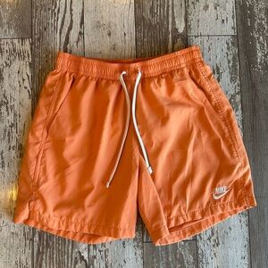 Nike Men's Club Essentials Woven Flow Shorts - orange, small